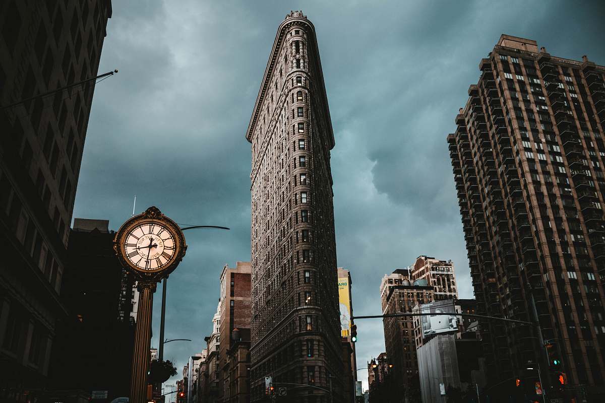 tower low-angle photography of buildings under cloudy sky clock tower